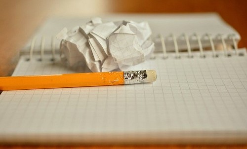crumpled paper and chewed pencil