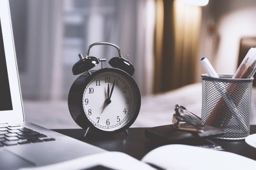 desk with alarm clock